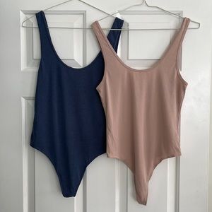 Two thong style body suit tank tops.